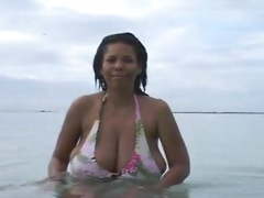 Busty Dominican MILF at the Beach (softcore)